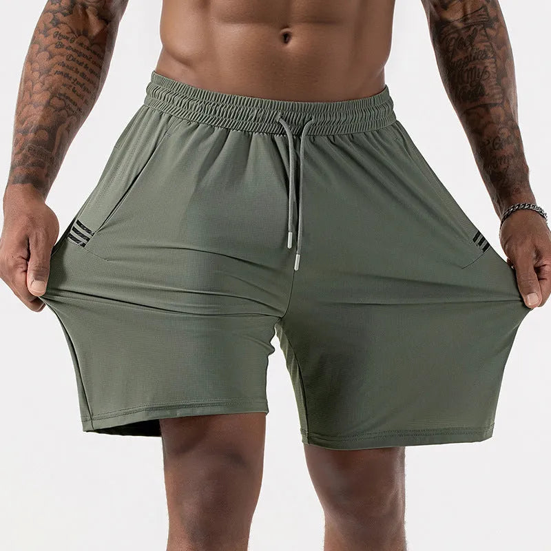 Man wearing black ice silk sport shorts with a high waist and cropped length.