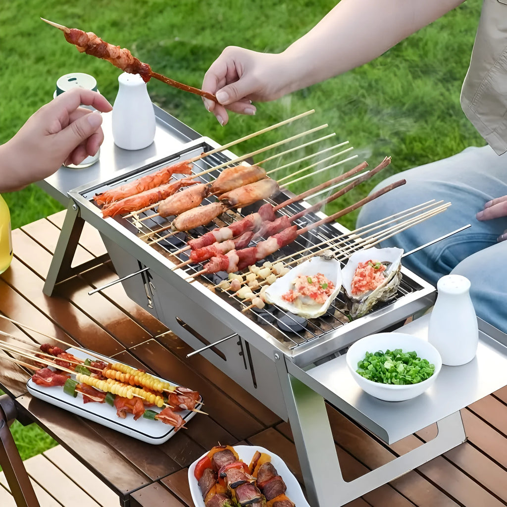 Small portable charcoal grill with foldable legs, shown collapsed for storage.