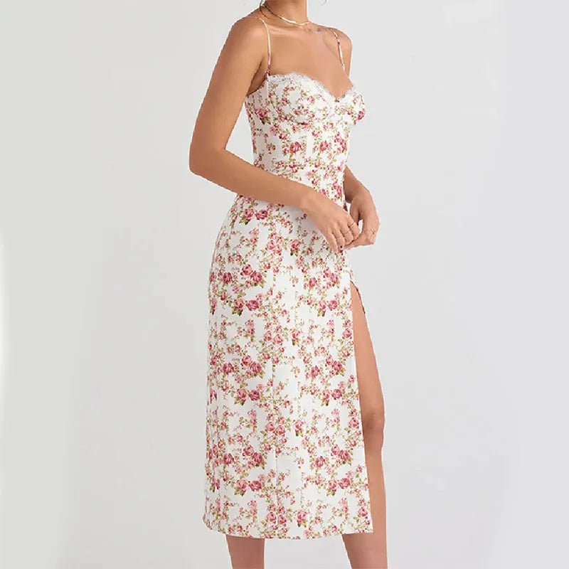 Women's long blue summer dress with lace flowers print, suspender straps, and a side slit.