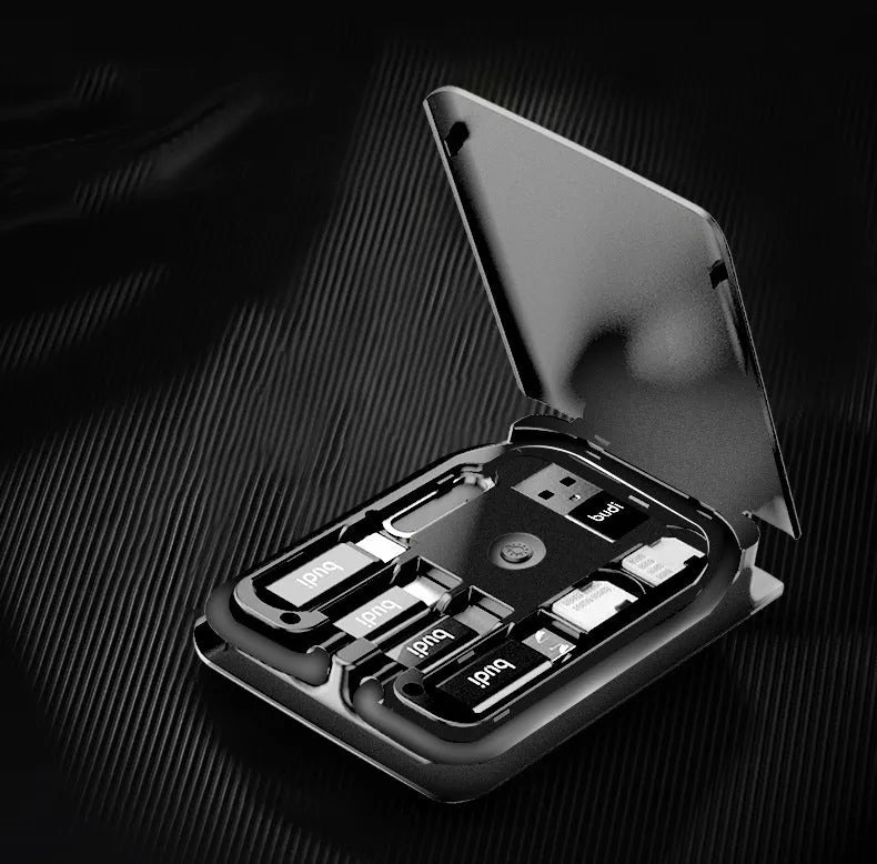Black digital urban survival card with a short attached cable, conversion head, and slots for TF and nano SIM cards.