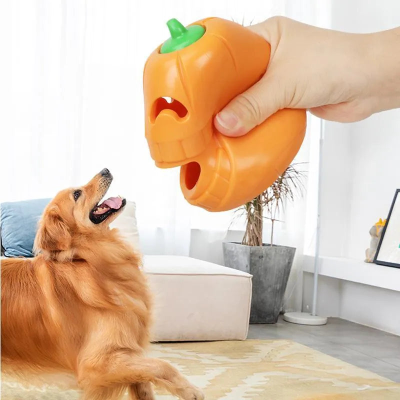 Yellow pumpkin-shaped TPR dog chew toy for aggressive chewers on a white background.