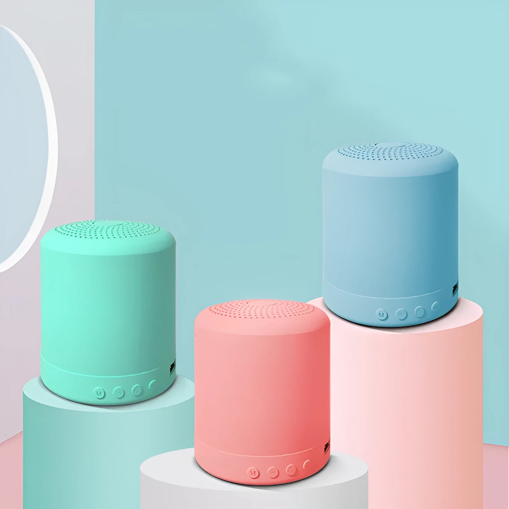 Small square A11 wireless subwoofer stereo speaker in black, pink, blue, or green colour.