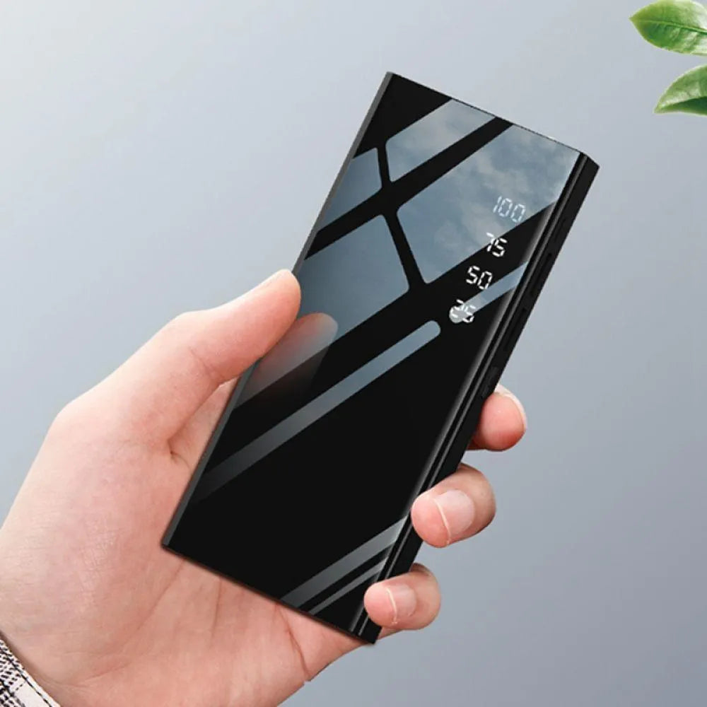 Black 20000mAh power bank with LCD display showing battery level and two USB ports