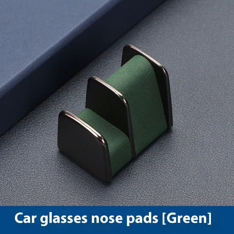Zinc alloy and leather car dashboard glasses clip holder in green colour.