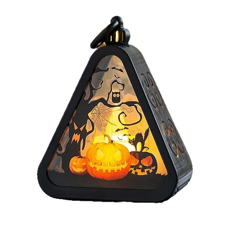 Portable Halloween pumpkin lamp decoration in pumpkin colour on a table