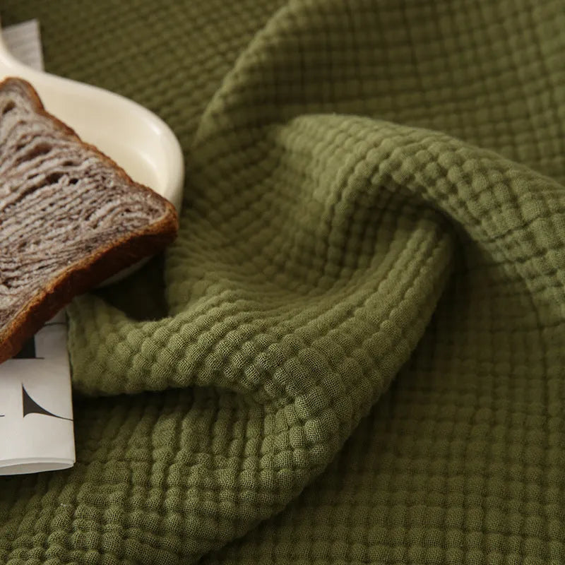 Four-layer gauze cotton blanket with edge tassels in a choice of ten colours and two sizes.
