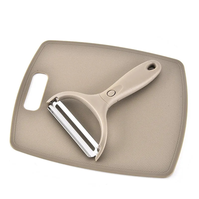 Brown eight-piece kitchen cutter set with peeler, knife and chopping board on wheat straw base