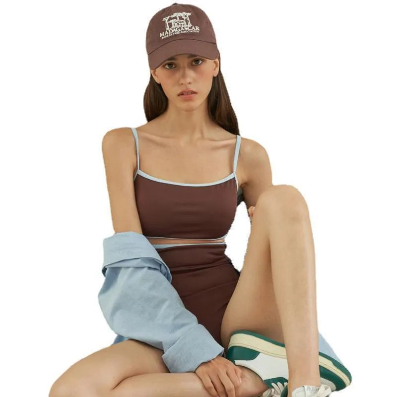 Brown women's one-piece swimsuit with a triangular style on a mannequin