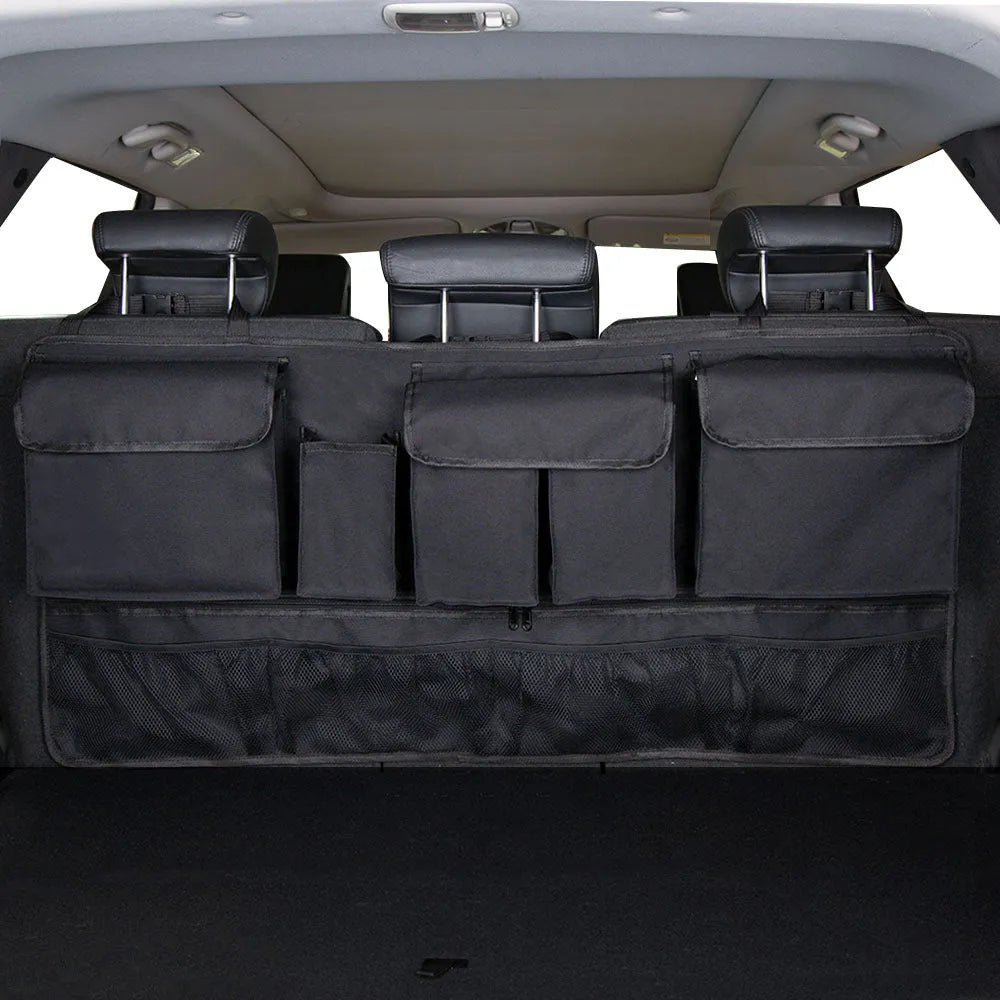 Black car boot hanging storage organiser made of Oxford cloth with a handle, shown hanging.