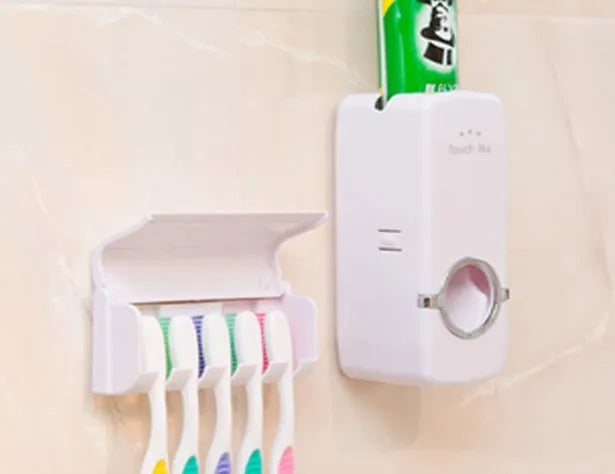 White and wine red plastic suction cup toothbrush and toothpaste holder set for bathroom walls.
