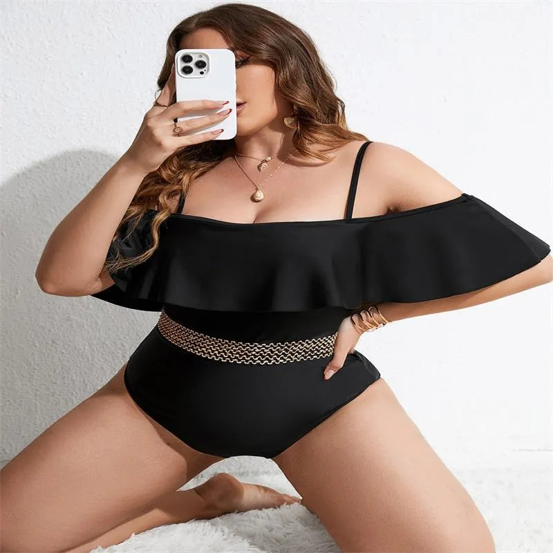 Black solid colour women's one-piece swimsuit on a hanger