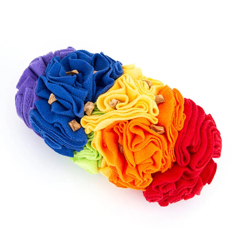 Dog snuffle pad made of polar fleece fabric in rainbow colour, 25x15cm, lying flat on floor