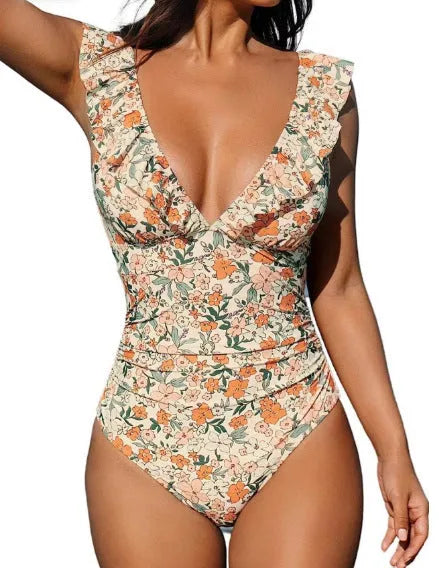 Women's apricot floral v-neck one-piece swimsuit with lace-up front detail, sleeveless design for swimming.