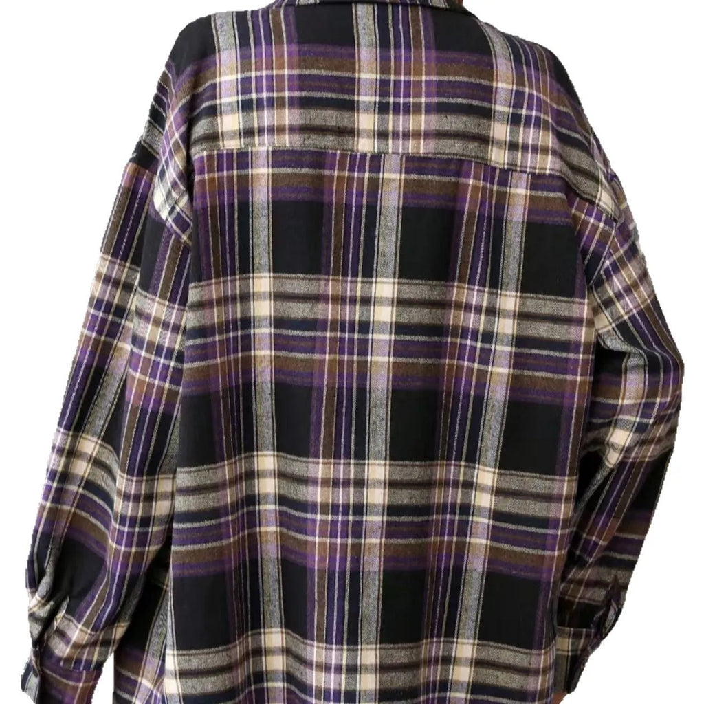 A woman's loose fit cotton plaid shirt in a retro style, shown in a choice of black, green, or purple colours.