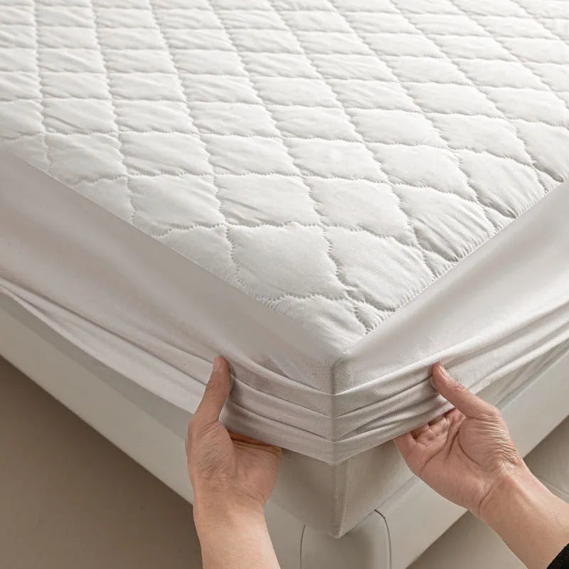 Diamond lattice quilted waterproof mattress protector fitted sheet set in solid colour.