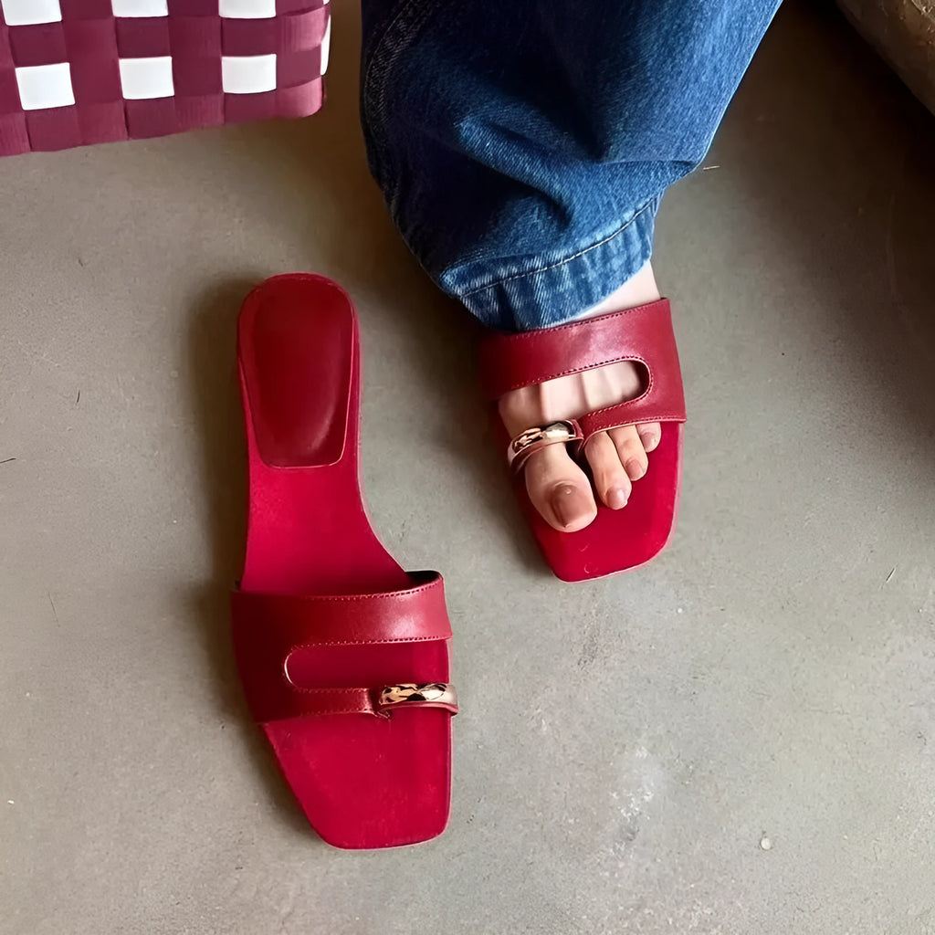 Plus size leather outdoor slippers with square toe in red, white, black, and silver on a rubber sole.