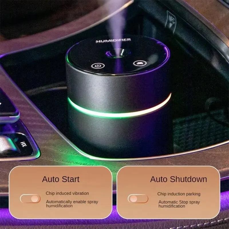 Black aluminium portable car humidifier and essential oil diffuser with night light on a desk