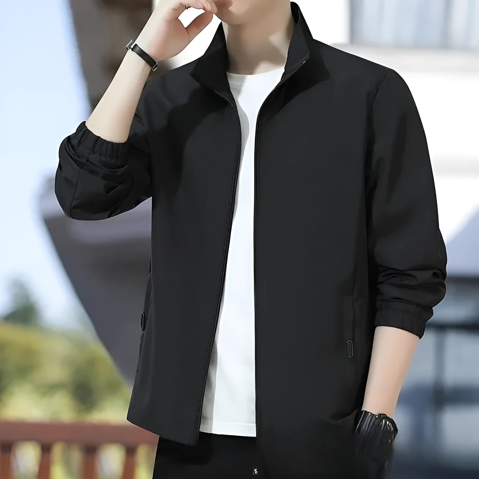 Man wearing a loose-fit grey Korean-style lapel casual jacket with zipper pockets.
