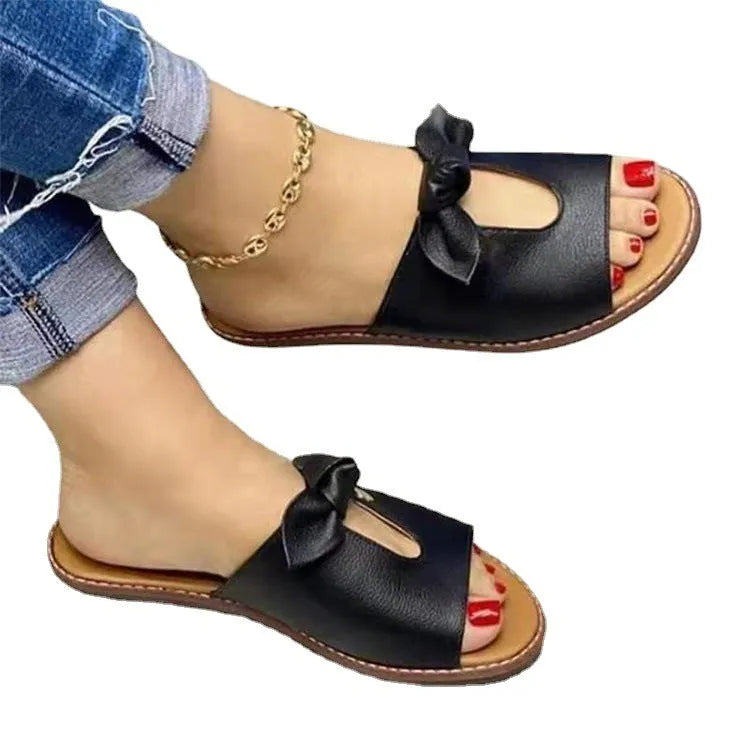 Ladies casual sandals with fish mouth design and bow decoration in black, pink, and gold colours.