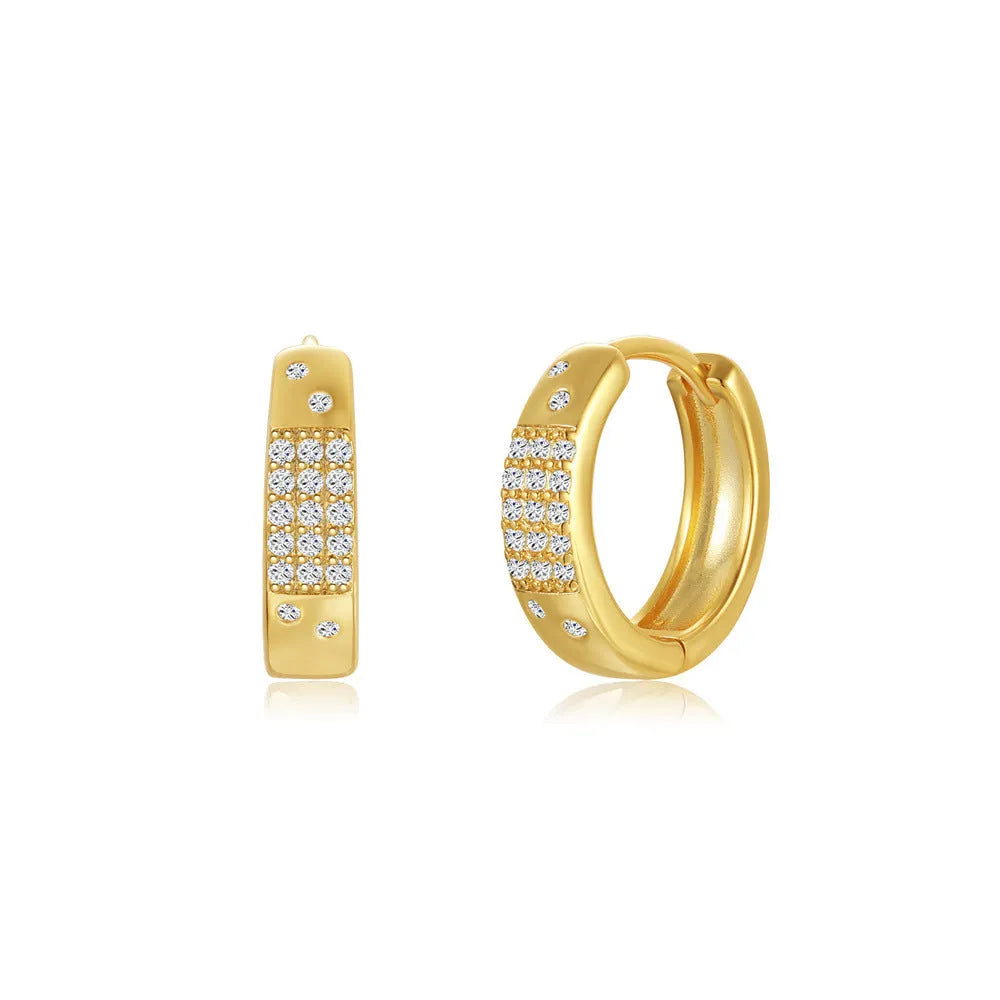 Geometric brass earclip earrings with a gold electroplated finish and round design details.