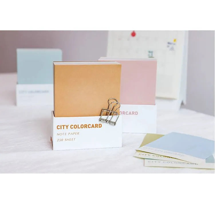 Rectangular memo note pad with creative city colour design, measuring 75 by 95 millimetres.