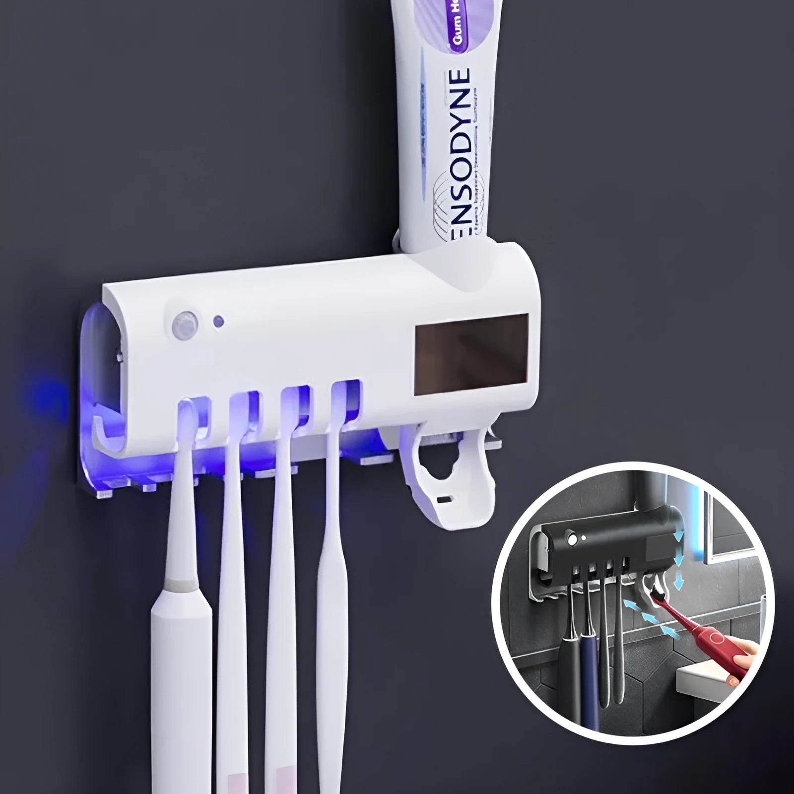 Black and white wall-mounted UV toothbrush steriliser with automatic toothpaste squeezer, showing solar panel and sensor.