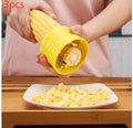 Yellow manual corn thresher with corn-cob shape and textured PP grip.