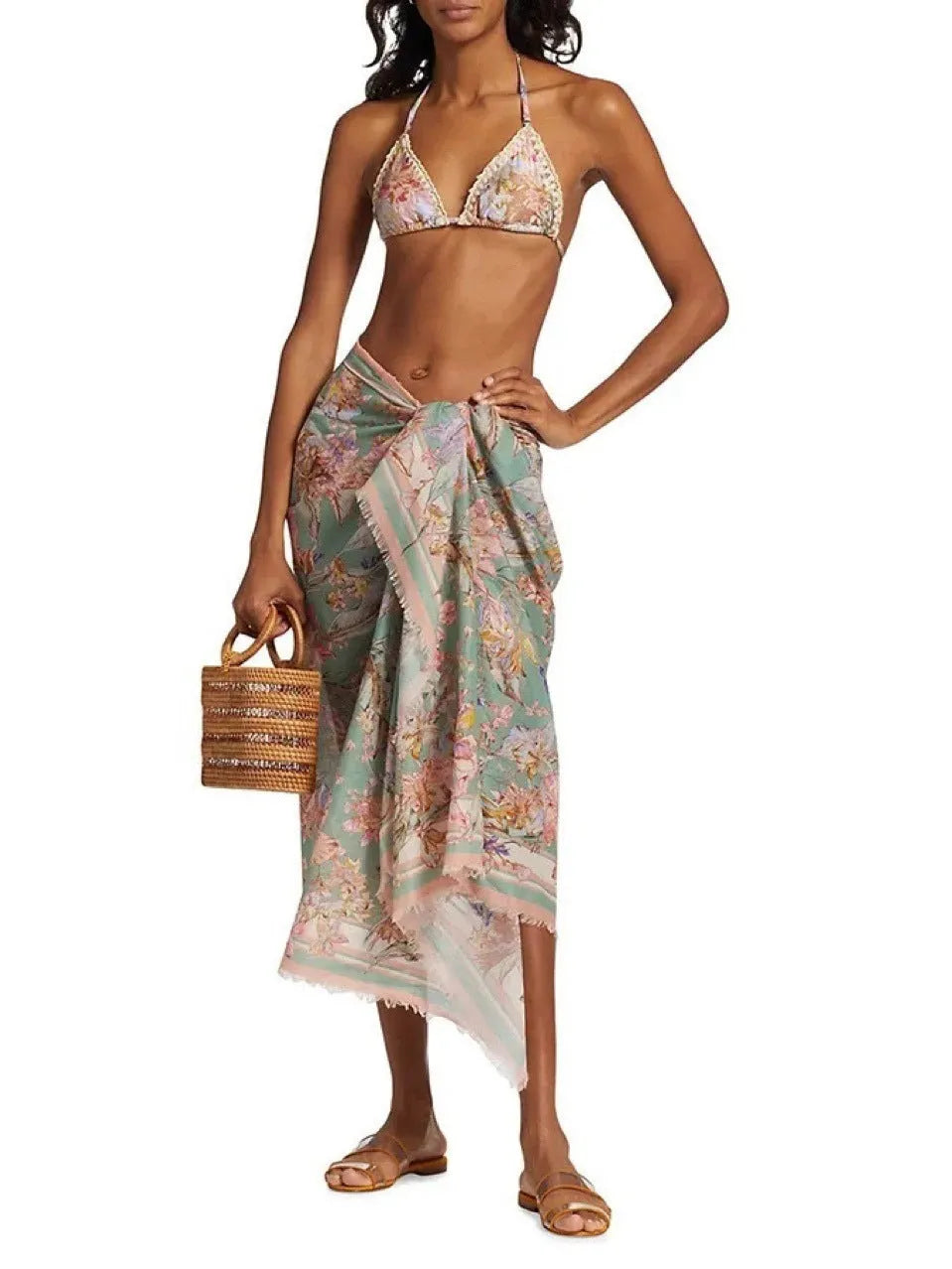 Women's floral print bikini set with top, briefs, and removable skirt in creamy-white colour