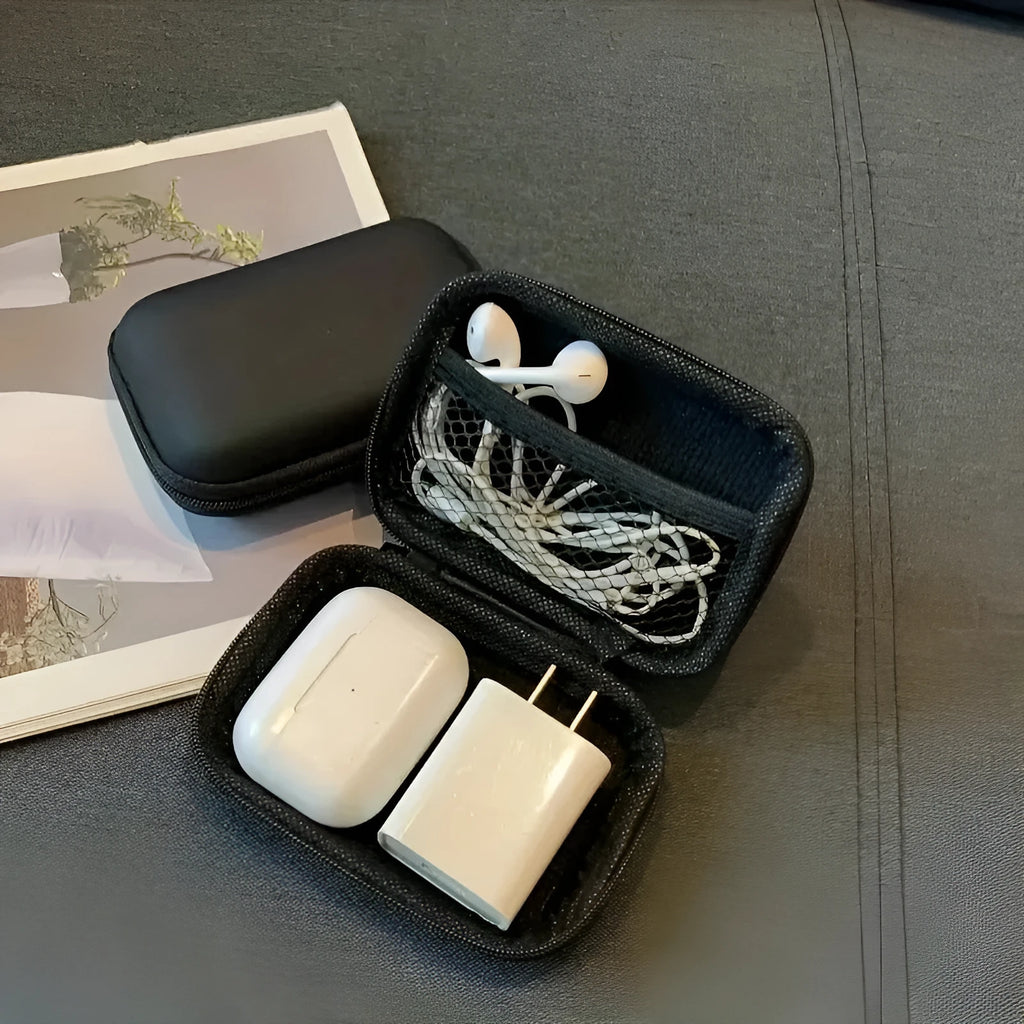 Compact black EVA travel storage box for headset cables, size 11x7.5x4 cm, on a neutral background.