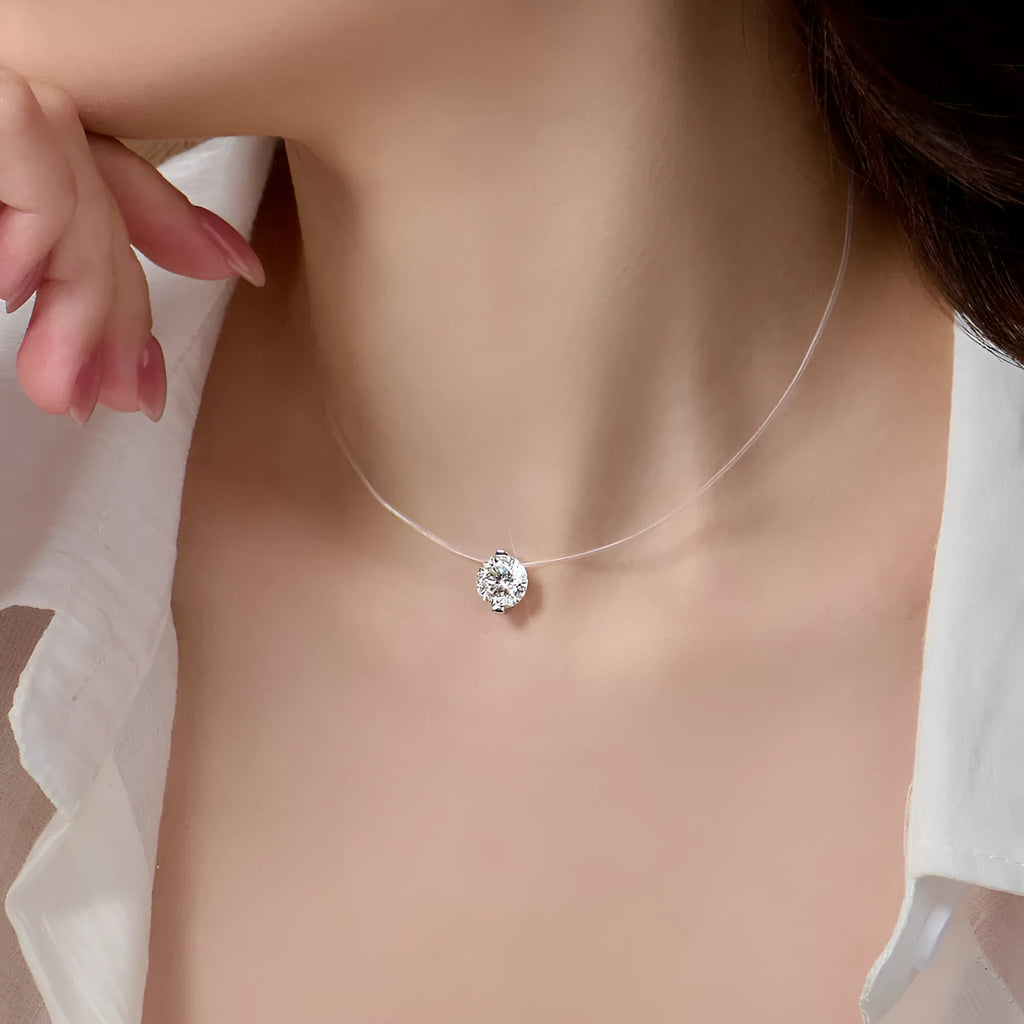 Women's sterling silver moissanite clavicle chain necklace with invisible fishing line setting.