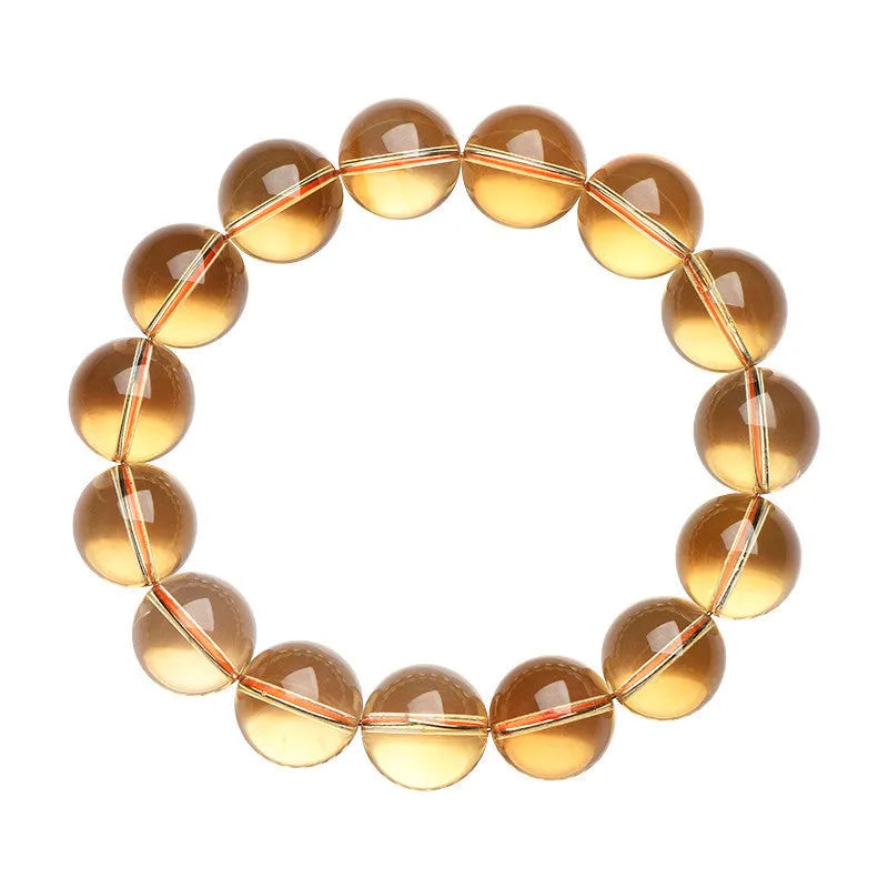 Natural citrine scattered beads ball bracelet showing polished stones on wrist.