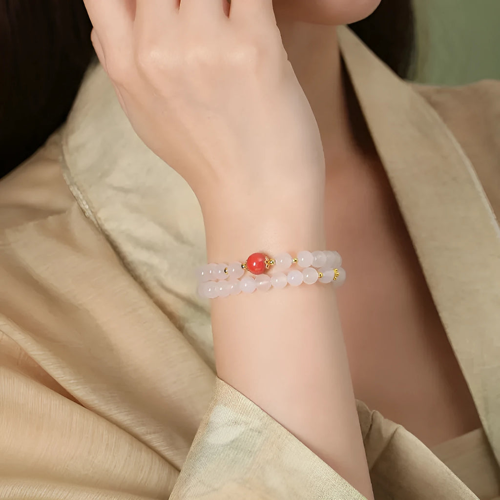 White double layer agate bracelet with 6mm geometry-shaped beads on a wrist