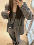 Women's light brown wool blend knit cardigan, vest, and loose pants three-piece casual set.