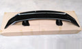 Universal punch-free car spoiler tail wing in ABS plastic on a vehicle.