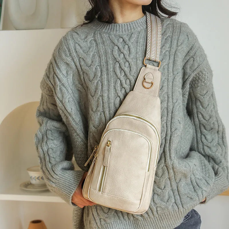 Women's soft brown PU leather crossbody chest bag with an open front pocket.