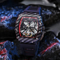 Mechanical men's watch with luminous hands on a black rubber strap, showing a stainless steel buckle.
