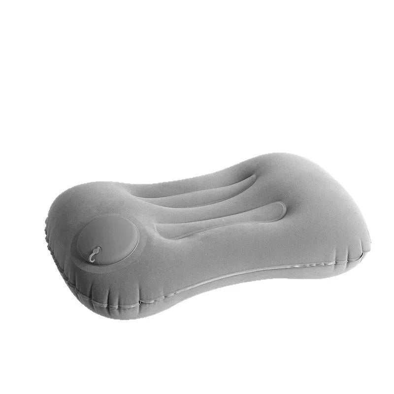 Inflatable travel pillow in grey flocking finish, shown inflated to its 45x30x13cm size with a soft texture.