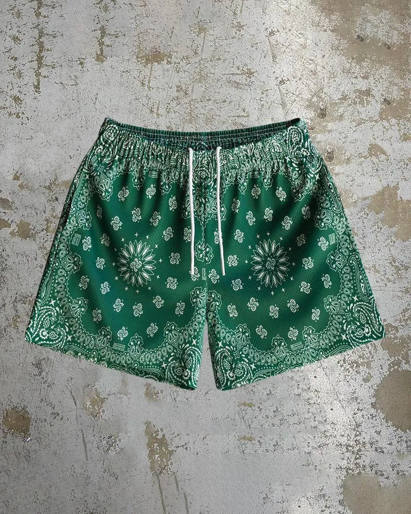 Mens loose fit quick-drying beach shorts with digital print design and elastic waistband in a light colour.