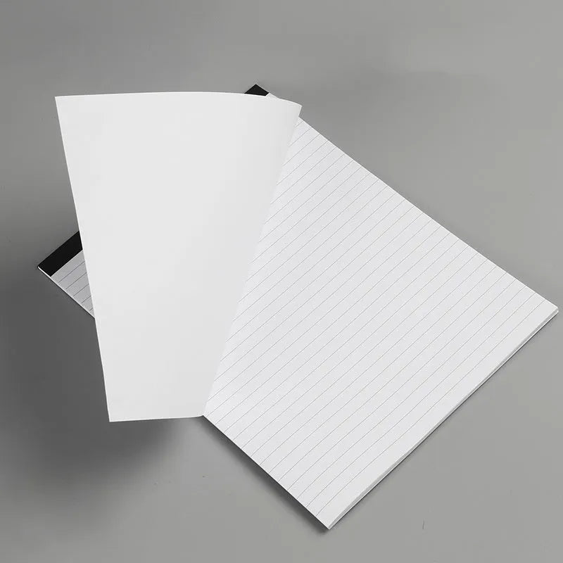 A4 tearable notebook with a paper cover, open to show ivory white gridded pages.