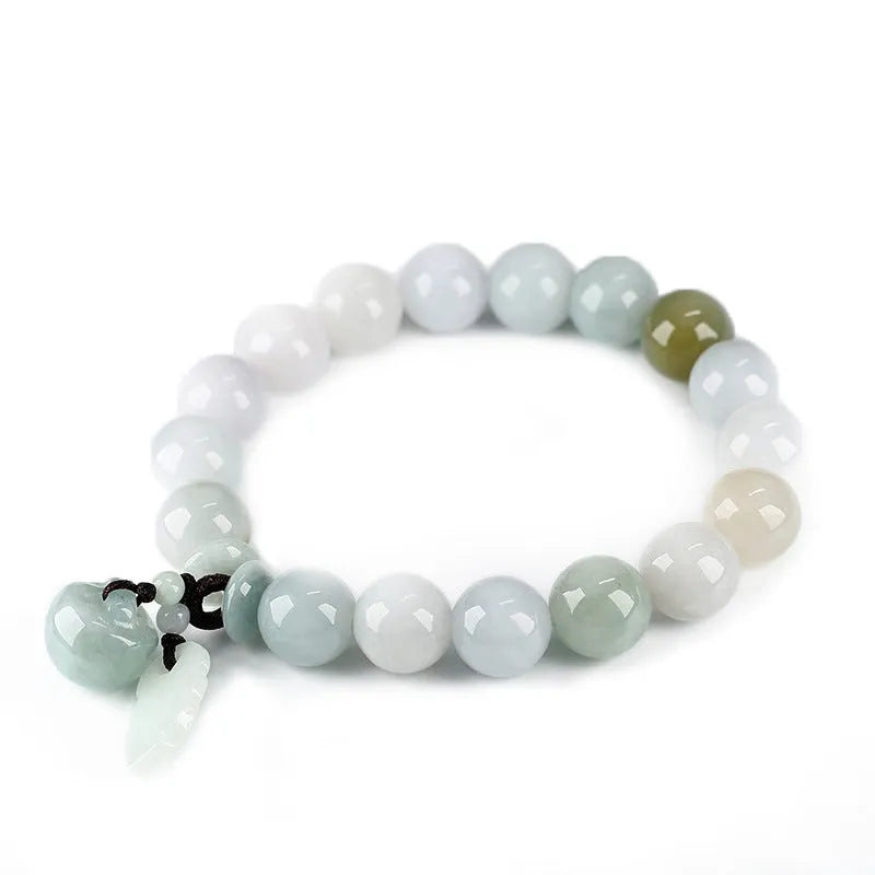 Green jade beaded bracelet with a hanging Maitreya Buddha charm on a wrist.