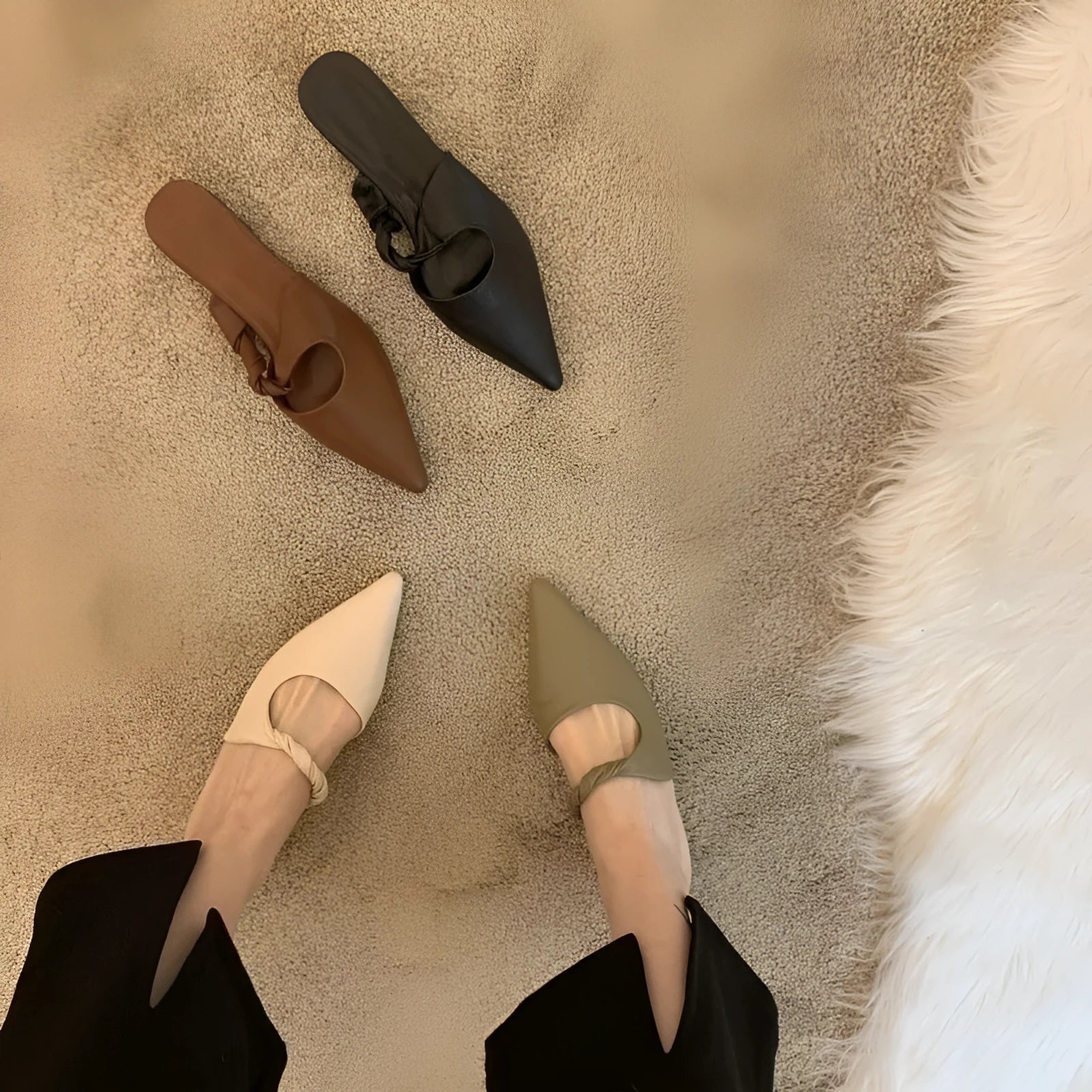 Women's semi-toe box slippers with leather lining and rubber sole in four colour options.