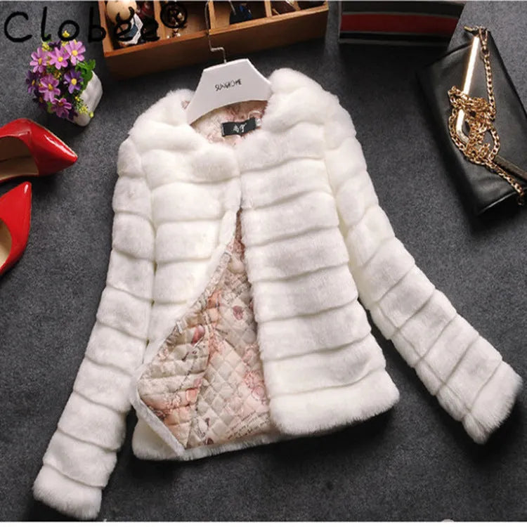 Women's short-length faux fur top in beige, black, or white with regular sleeves.