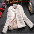 Women's short-length faux fur top in beige, black, or white with regular sleeves.