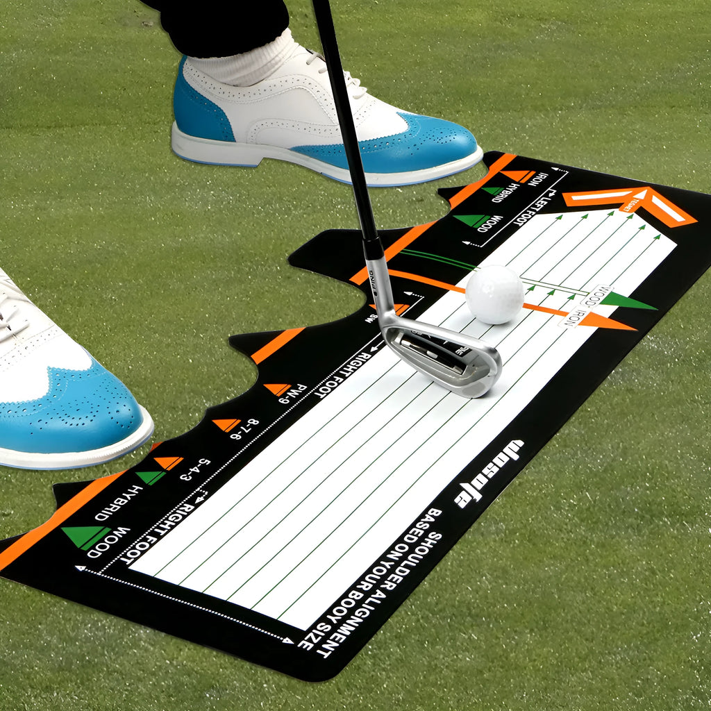 Black neoprene golf swing stance alignment pad on grass