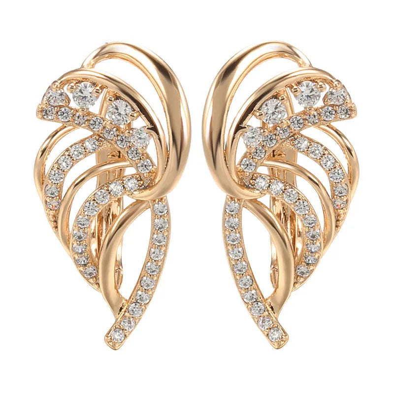 Gold-plated copper ear clips with geometric wing design and micro-inlaid zircon gemstones