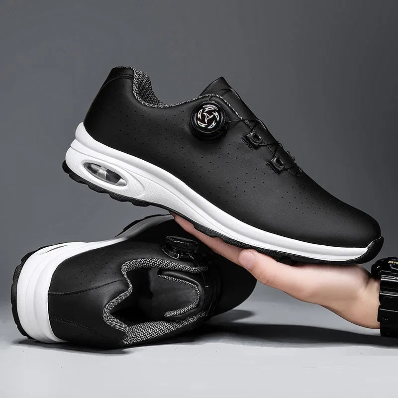 Low-top black and white mesh tennis shoes with cross-strap design and flat composite sole