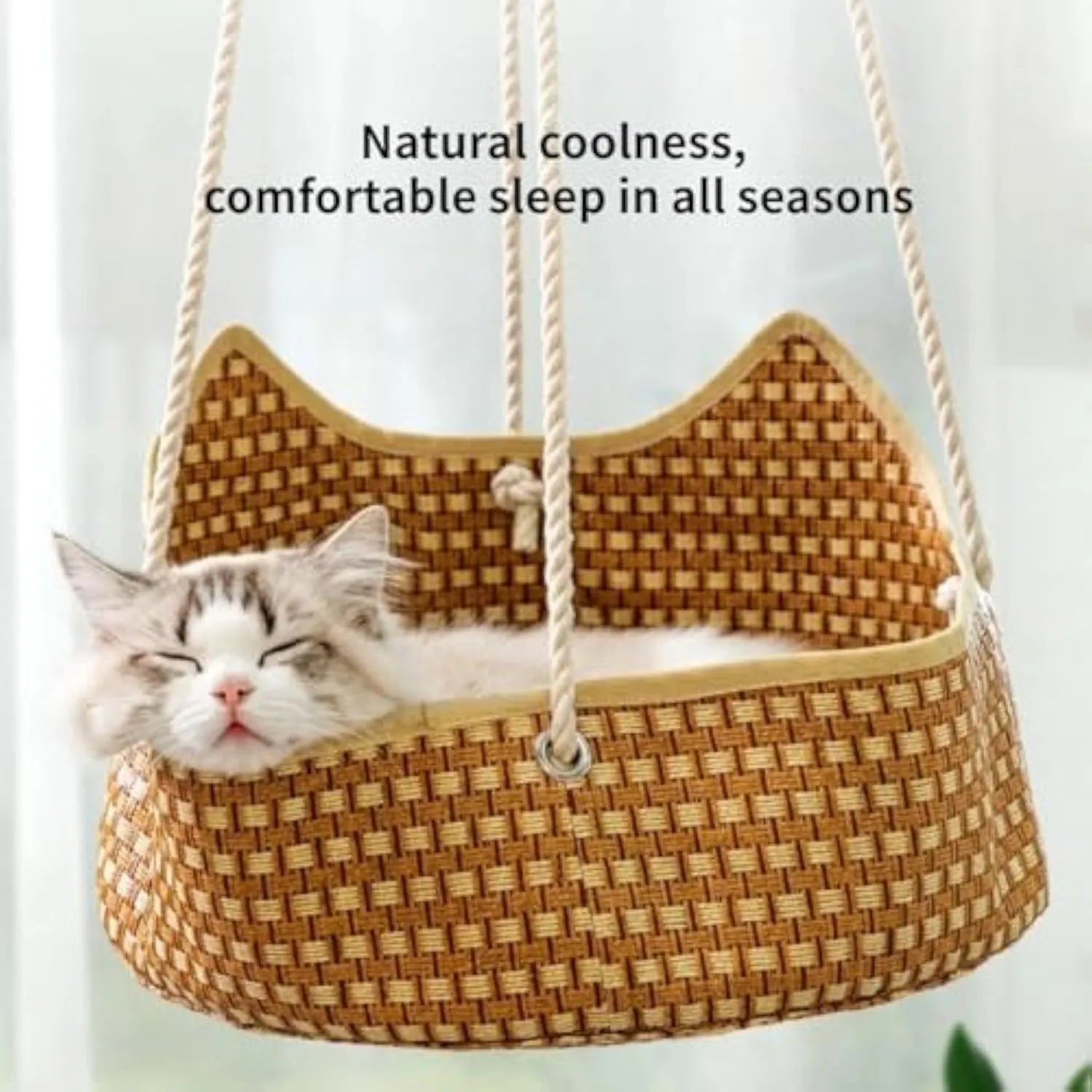 Green rattan cat hammock with metal hooks, shown hanging, suitable for small pets.