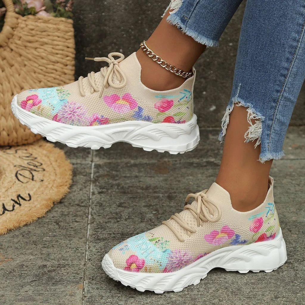 Women's floral print canvas walking sneakers with lace-up closure and rubber sole in pink