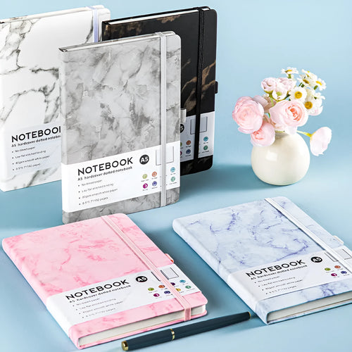 A5 office diary with hand skin feeling PU leather cover and strap closure, open to show horizontal line pages.