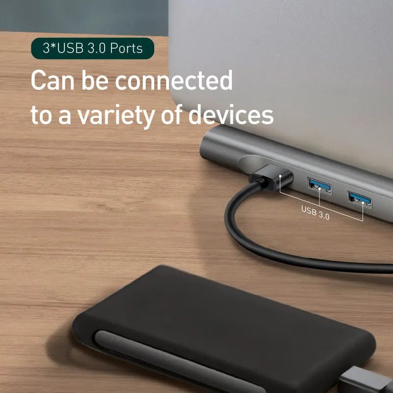 Grey 10-port aluminium docking station with cooling bracket showing HDMI, VGA, and USB connections